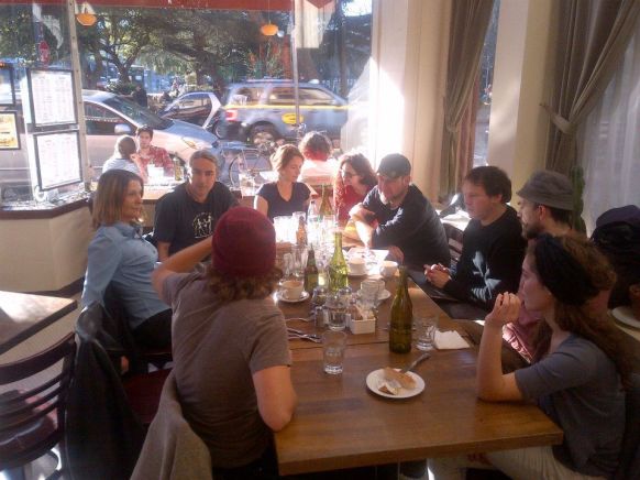 David Graeber discusses with SFAI faculty and students, sitting around restaurant table