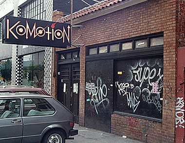 Front door of Komotion at 2779 16th Street, San Francisco, full of graffiti